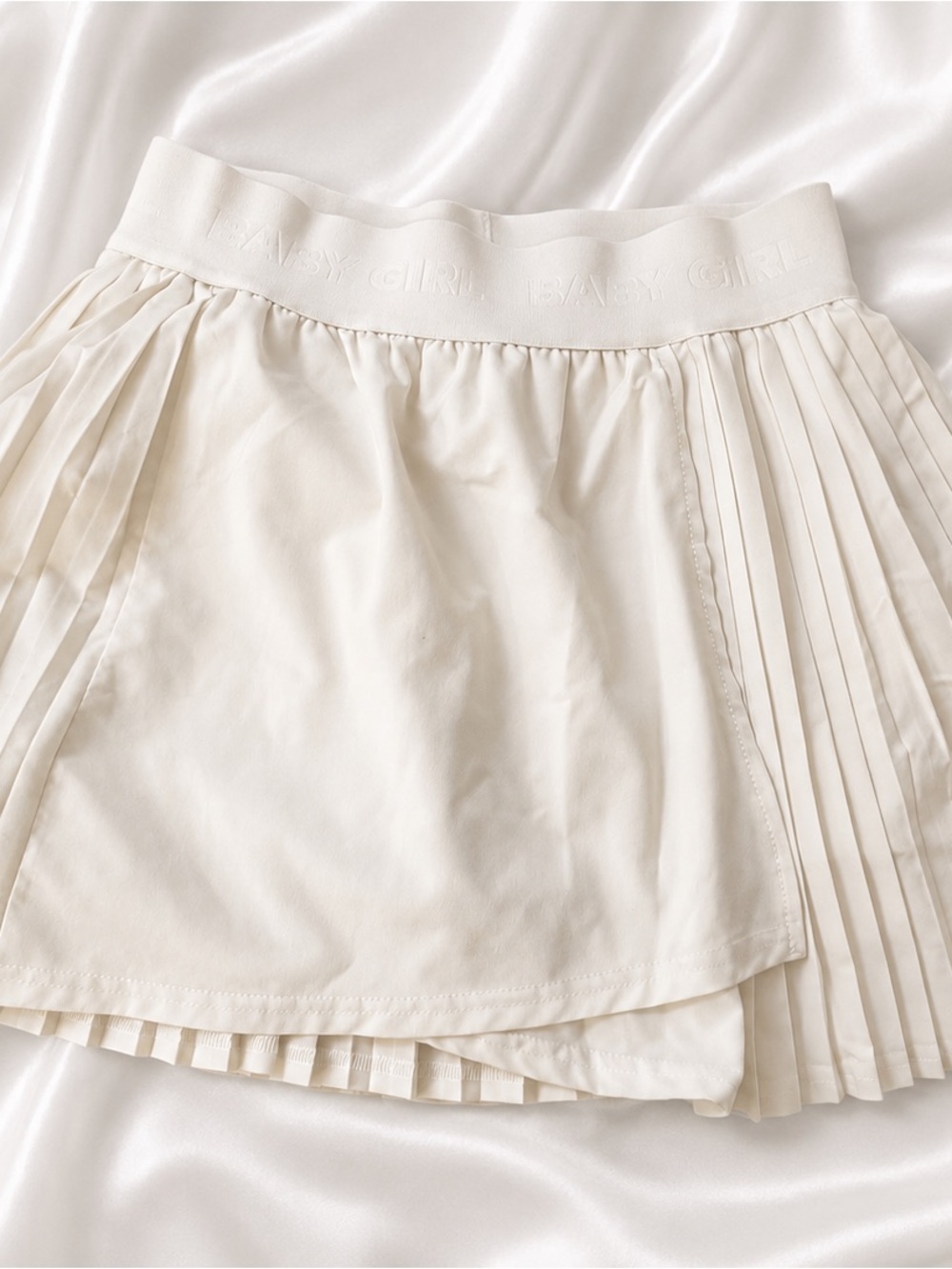Pleated Tennis Skirt in Cream with under leggings
